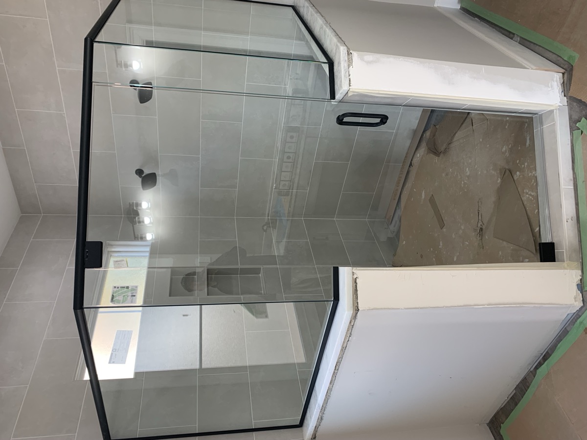 Glass shower door installation photo from Jan 2023