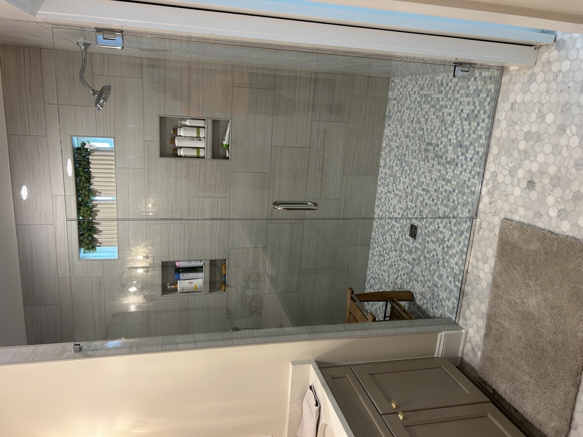 Glass shower door in a remodeled bath